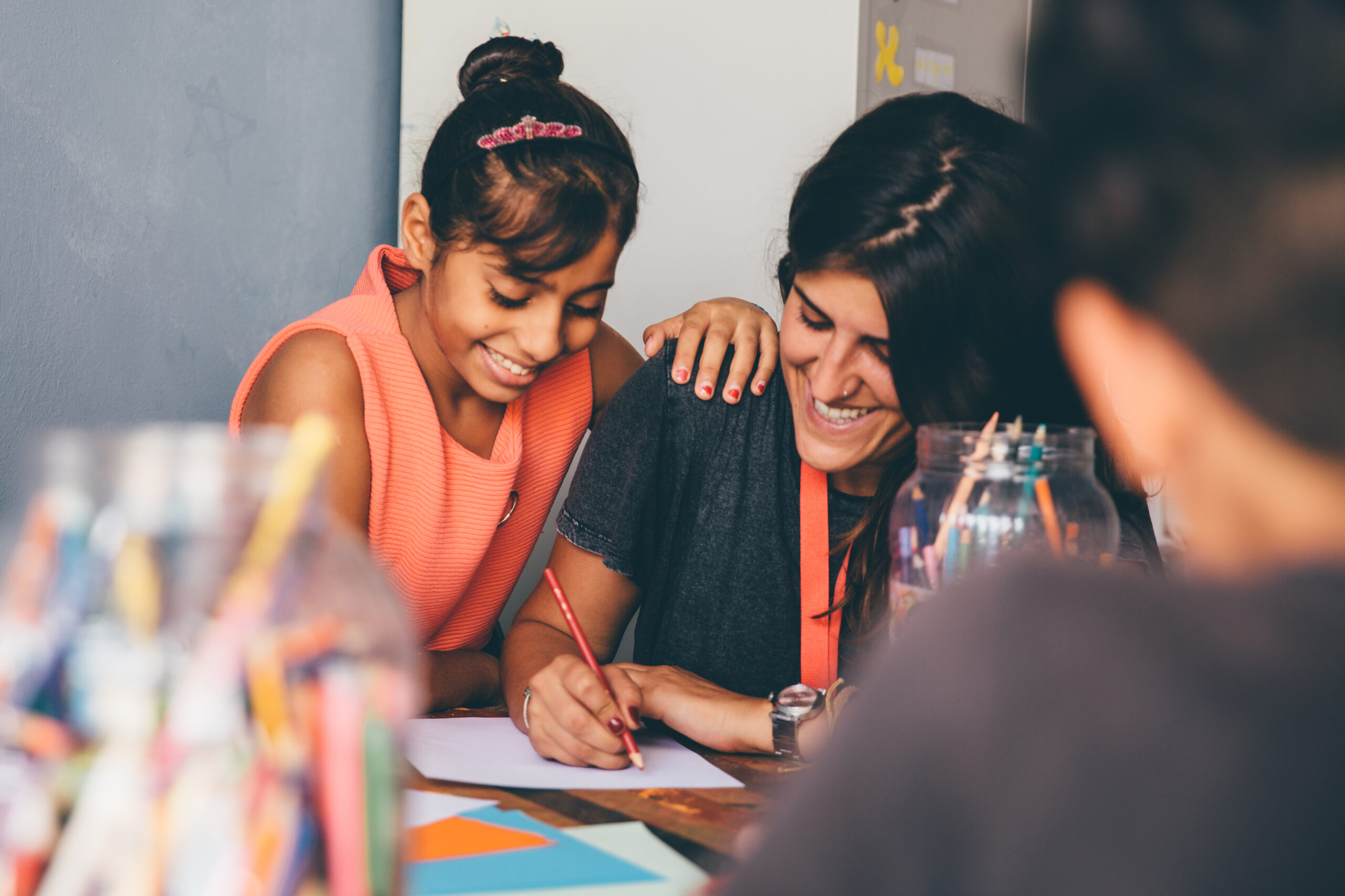 Women working together at a table in an image featured in METAdrasi’s prize announcement.
